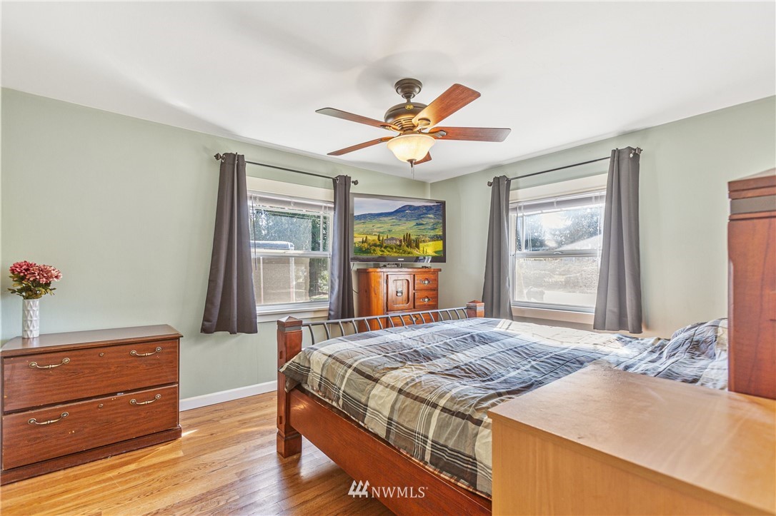 7011 Cady Road Everett, WA 98203 - Photo 24 of 32 a bedroom with a bed dresser and a window
