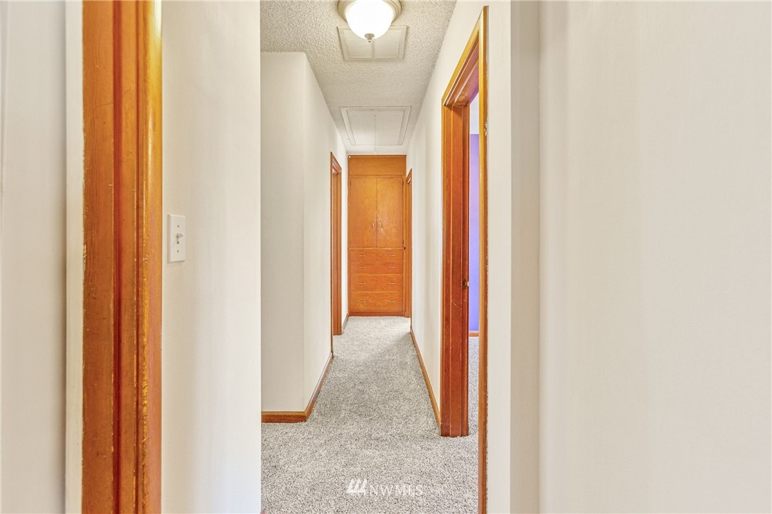 7011 Cady Road Everett, WA 98203 - Photo 28 of 32 a view of a hallway with wooden floor