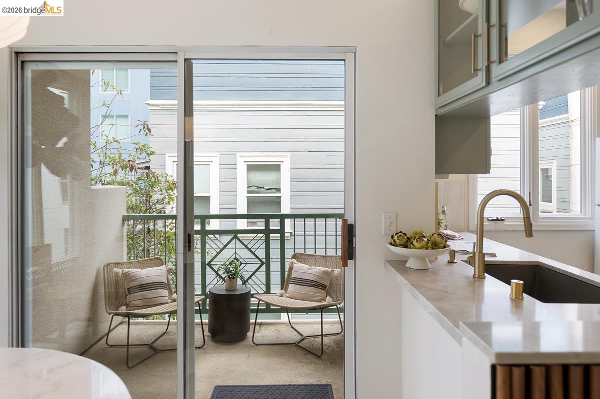 2029 Channing Way, Unit 3D Berkeley, CA 94704 - Photo 49 of 54 Balcony with sliding glass door access, featuring a decorative metal railing and concrete flooring