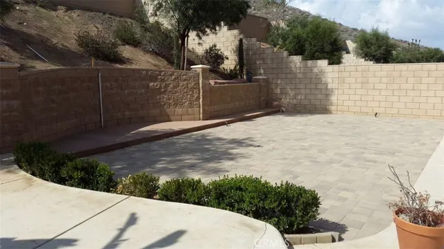 a view of a backyard of the house