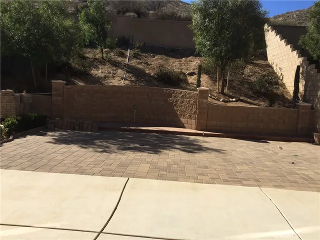 a view of a backyard of the house