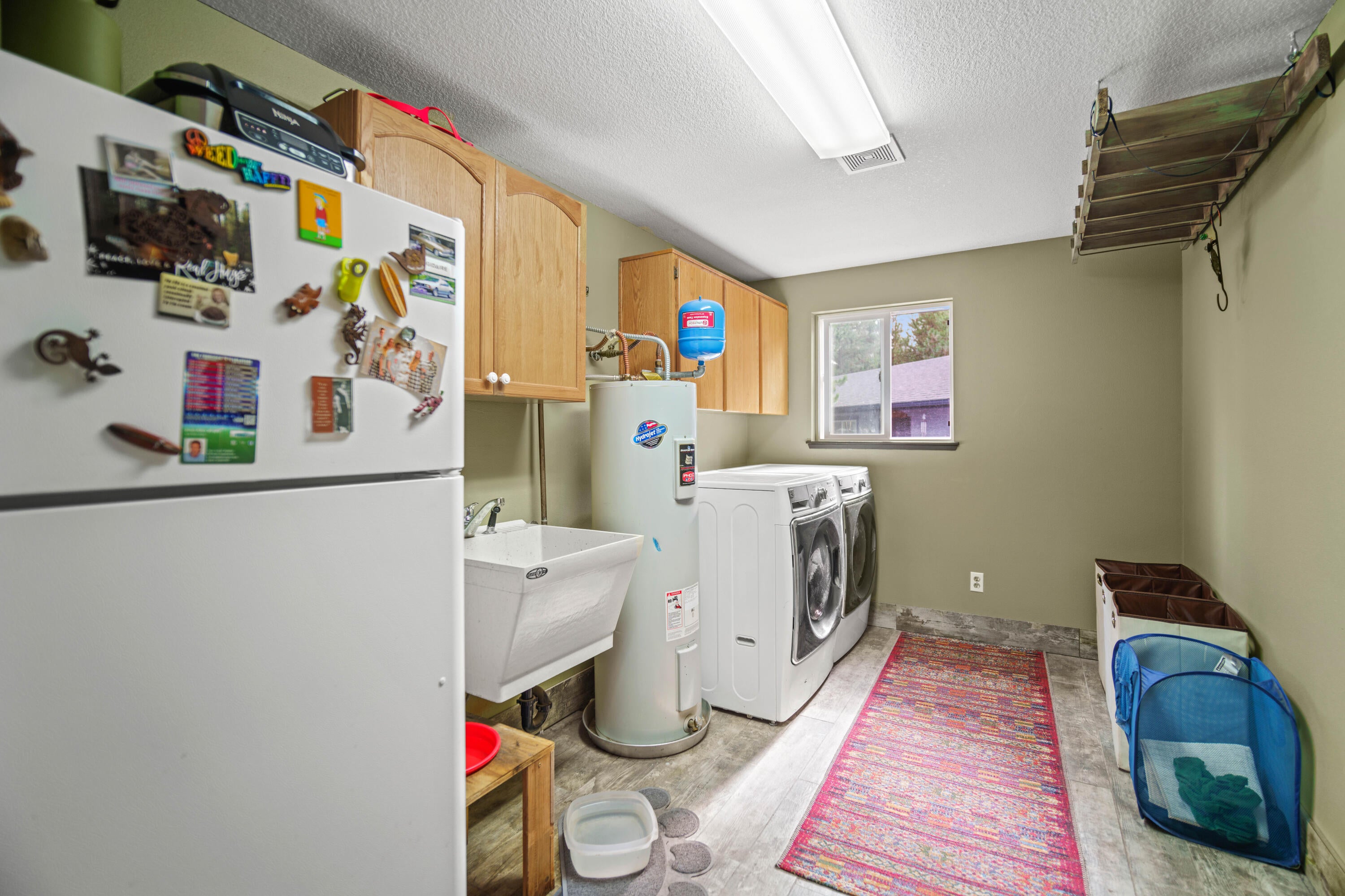 55884 Black Duck Road Bend, OR 97707 - Photo 18 of 41 Spacious laundry with utility sink and garage access