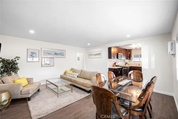 a brick house with a tree in front of it