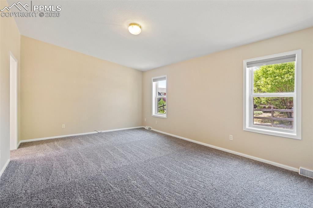 7765 Valley Quail Point Colorado Springs, CO 80922 - Photo 22 of 37 an empty room with windows