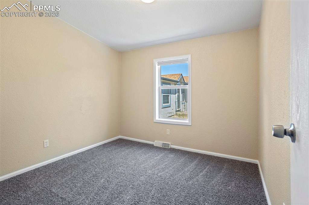 7765 Valley Quail Point Colorado Springs, CO 80922 - Photo 26 of 37 an empty room with windows