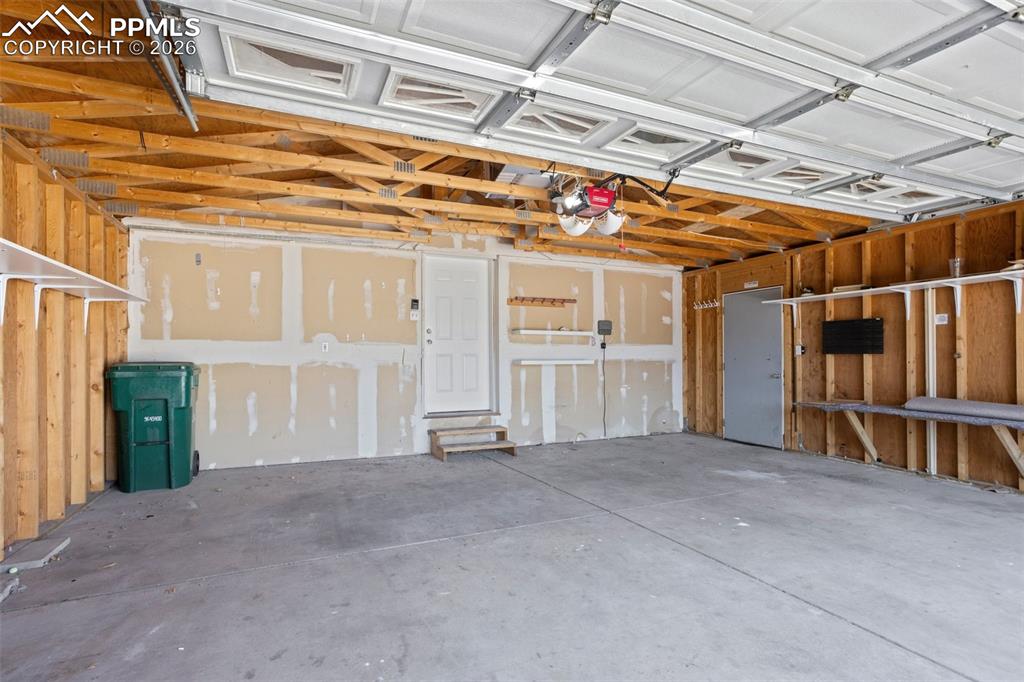 7765 Valley Quail Point Colorado Springs, CO 80922 - Photo 33 of 37 a view of a room with wooden walls