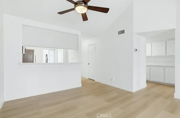 a view of an empty room with a window