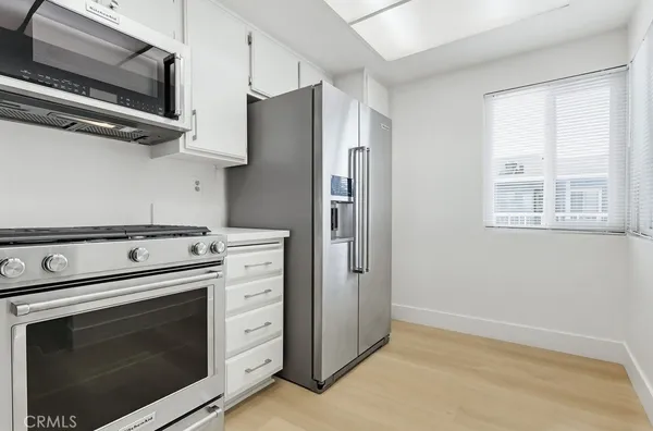 a kitchen with a stove and a microwave