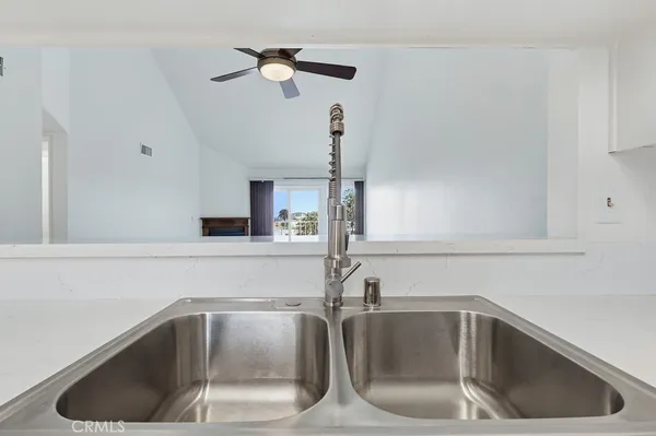 a kitchen with a sink and a window