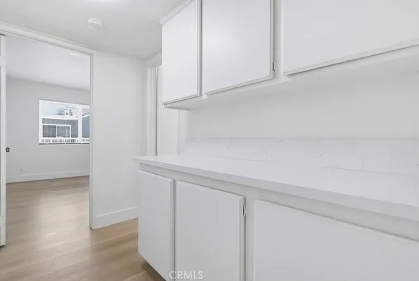a view of cabinets and wooden floor