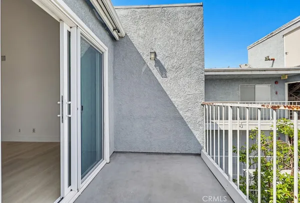 a view of a balcony with staircase
