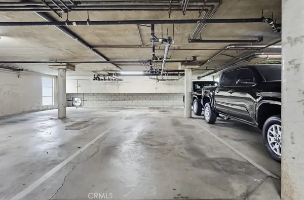 a view of parking garage with cars