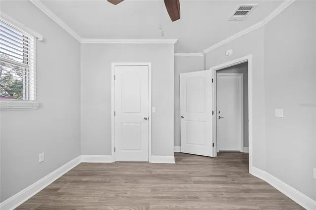 a bathroom with a white bath tub a sink and a mirror