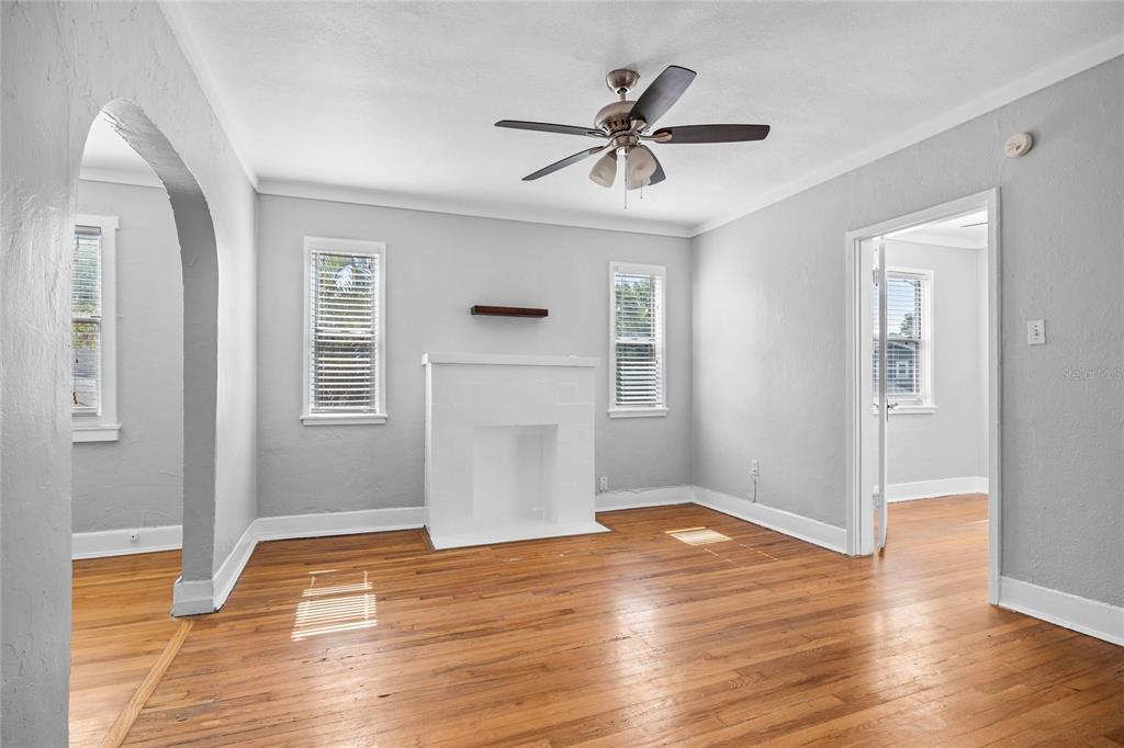 3205 West San Pedro Street, Unit 1 Tampa, FL 33629 - Photo 18 of 35 a view of empty room with wooden floor and window
