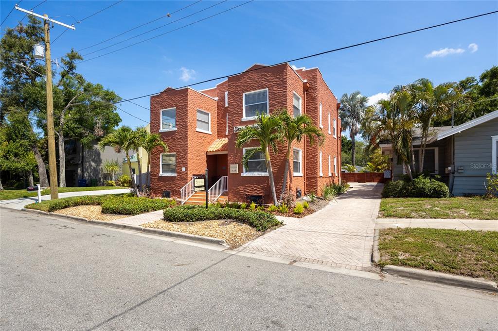 3205 West San Pedro Street, Unit 1 Tampa, FL 33629 - Photo 2 of 35 a front view of a house with a yard and potted plants