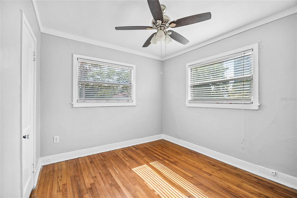 3205 West San Pedro Street, Unit 1 Tampa, FL 33629 - Photo 25 of 35 a view of a room with a ceiling fan and wooden floor
