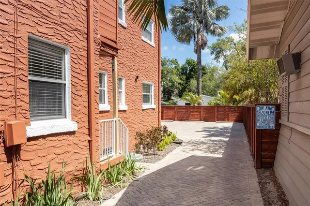a backyard of a house with a tree