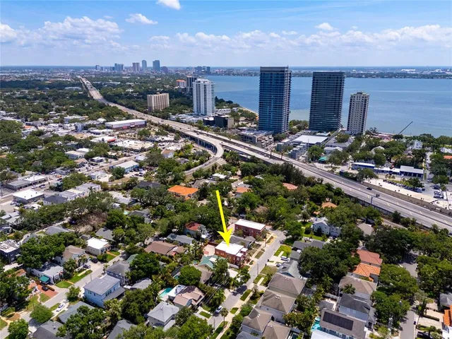 an aerial view of residential house with outdoor space and street view