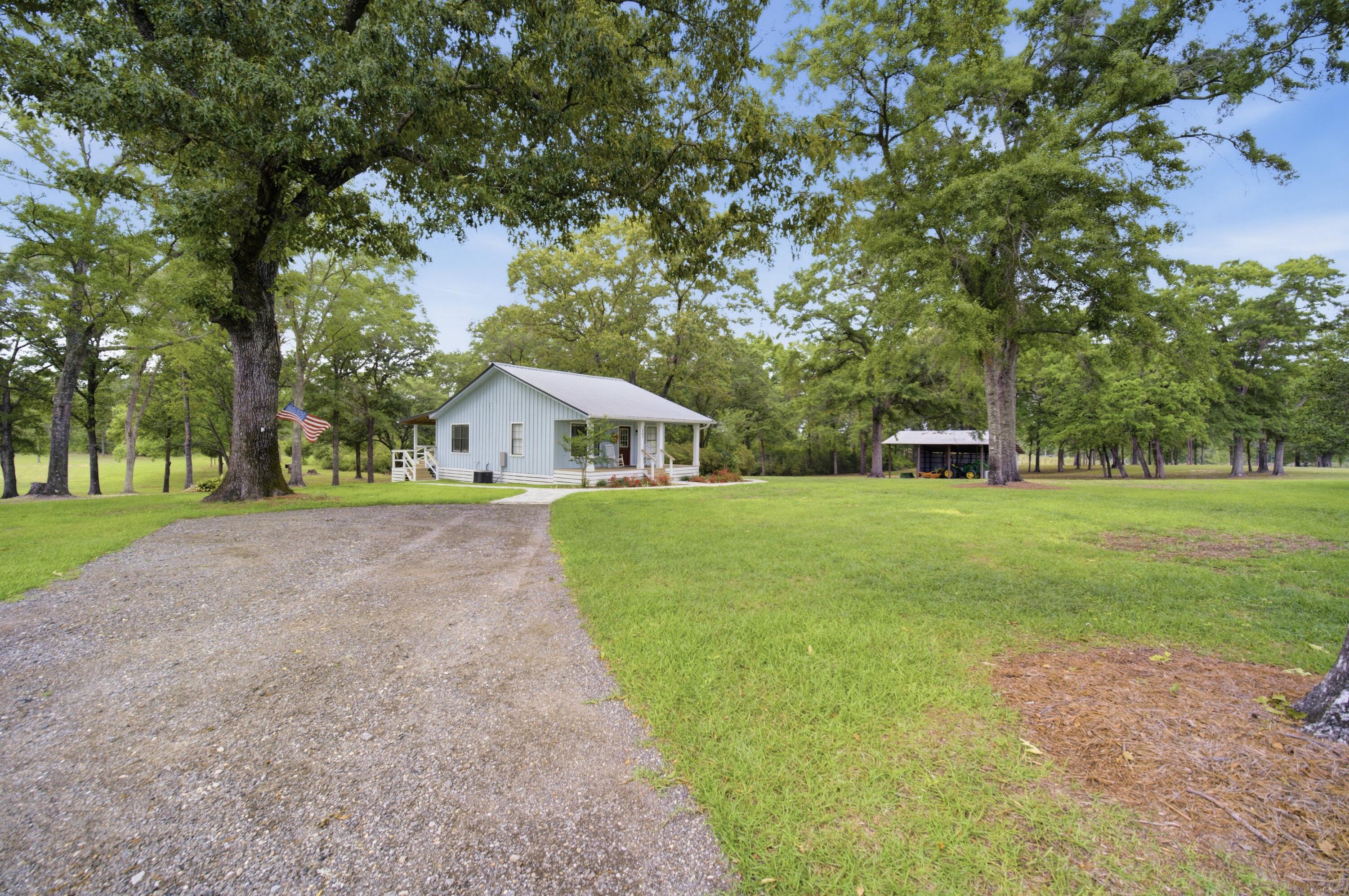 261 Wilkerson Road DeFuniak Springs, FL 32433 - Photo 37 of 76 a front view of house with yard and green space