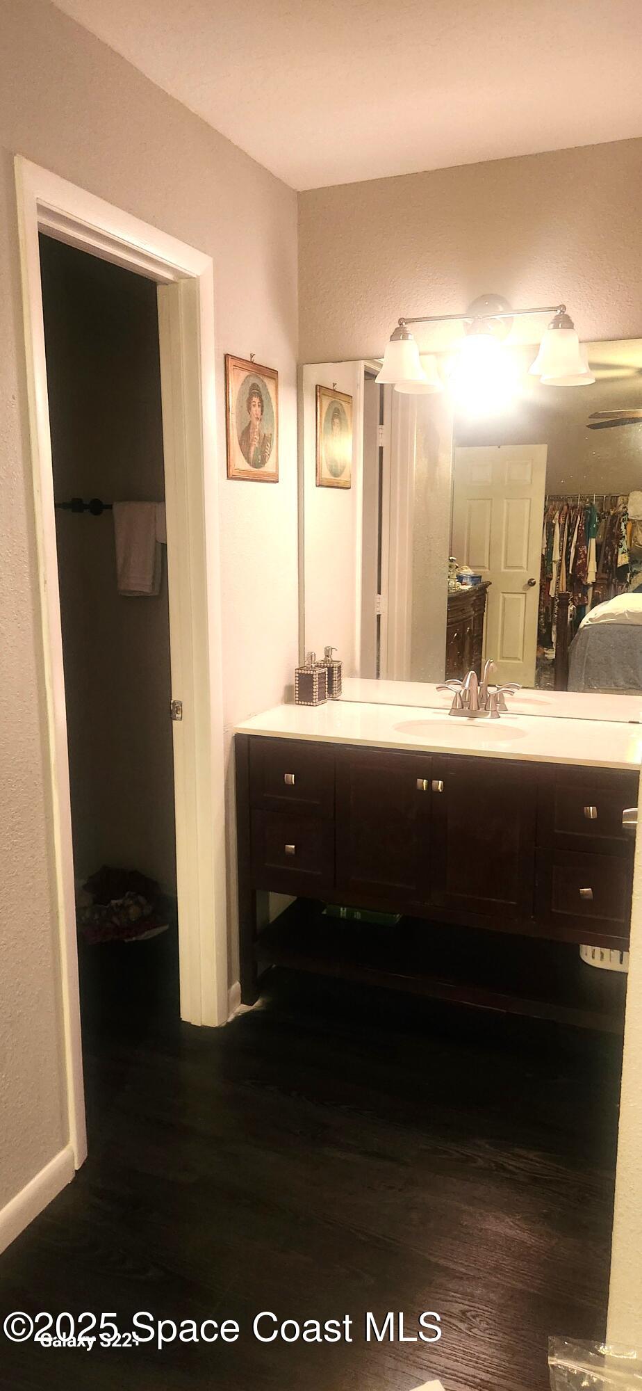 2014 Manor Drive Northeast Palm Bay, FL 32905 - Photo 12 of 15 a bathroom with a sink and a mirror