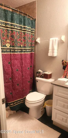 a bathroom with a toilet and a sink