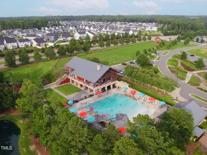 an aerial view of a golf course with parking space