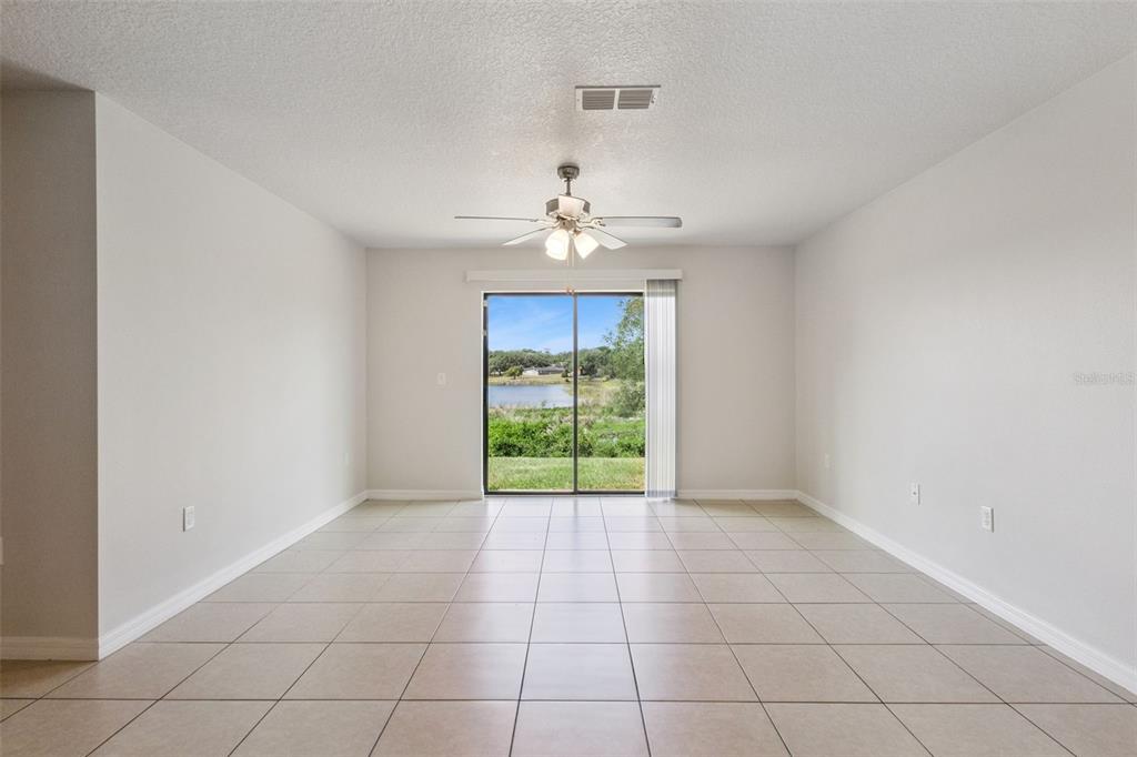 1613 Orne Street Mascotte, FL 34753 - Photo 15 of 31 a view of an empty room with a window