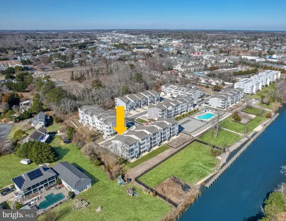 an aerial view of a house with a swimming pool