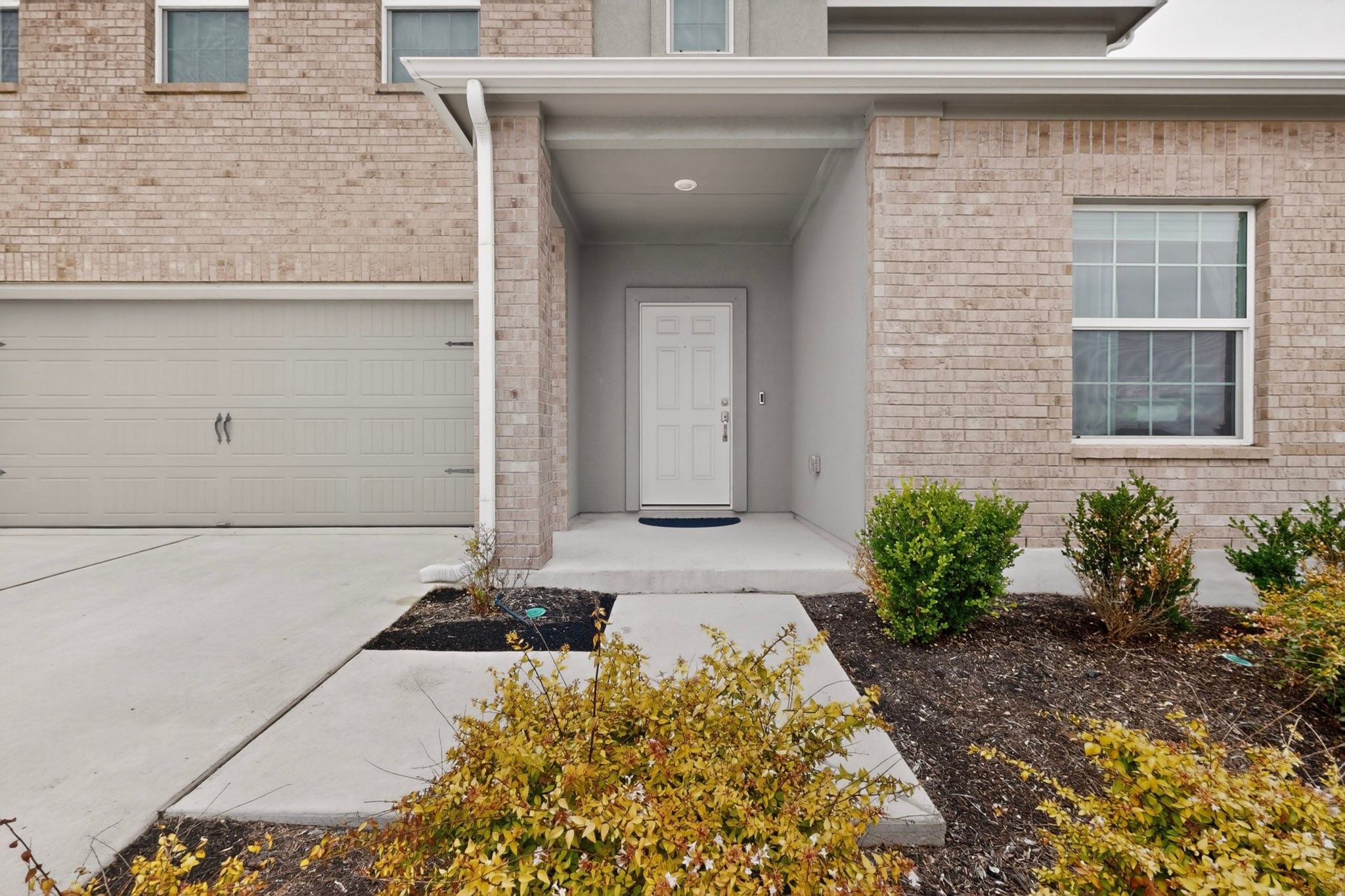 936 Mallow Road Leander, TX 78641 - Photo 4 of 16 Front facade featuring light-colored brick and stucco accents