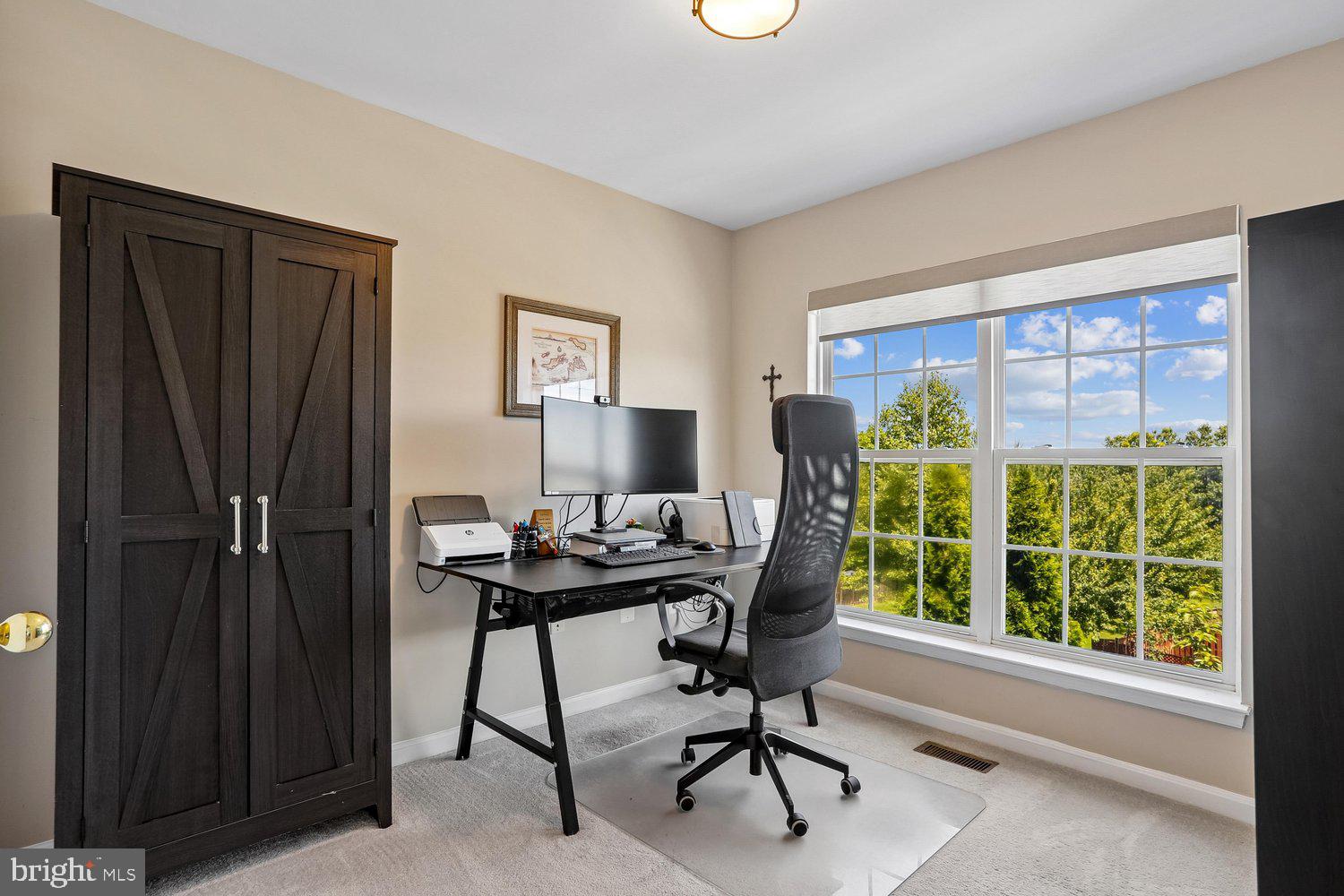 2530 Carrington Way Frederick, MD 21702 - Photo 21 of 38 a view of a workspace with furniture and a window