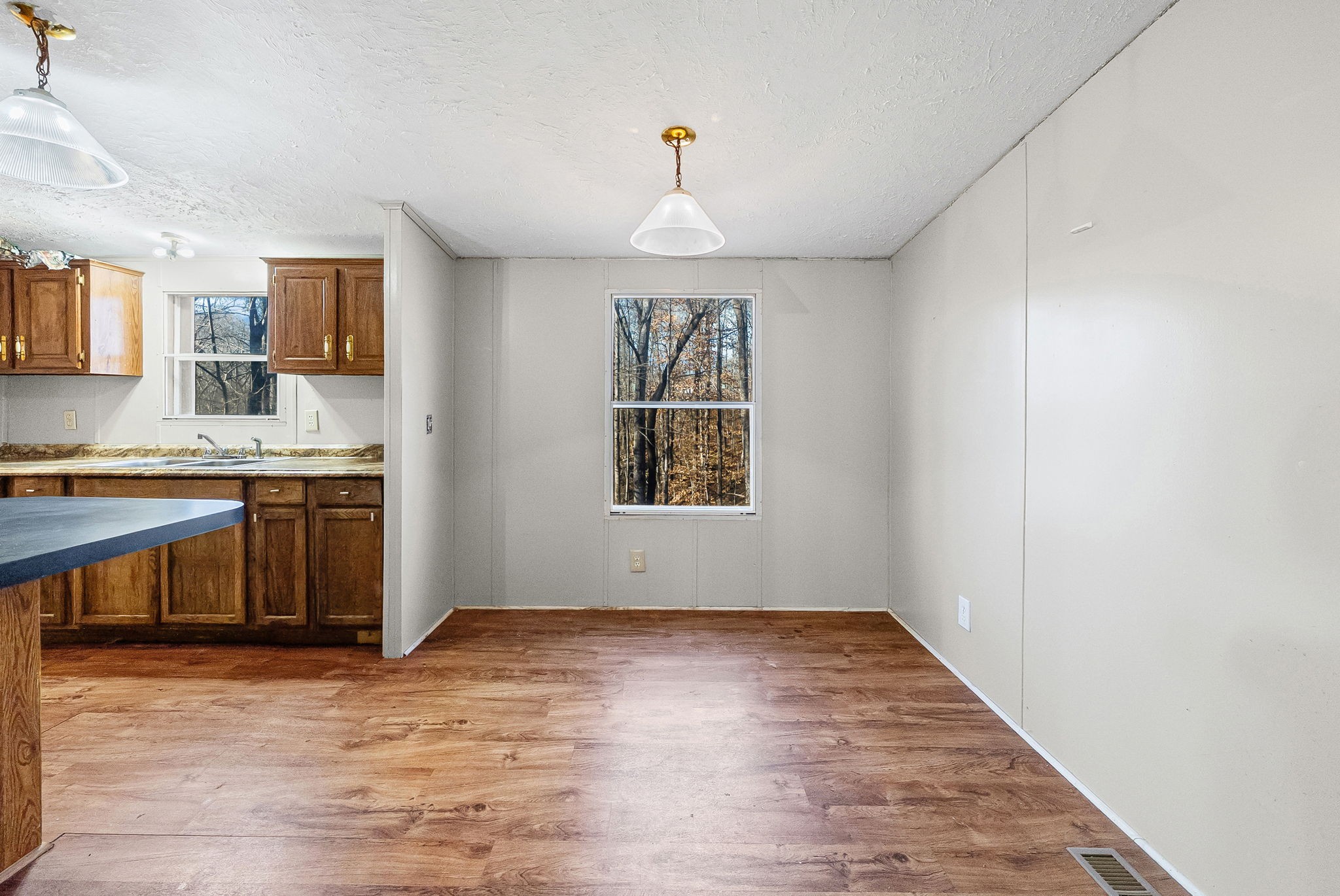 1105 Valley View Road Ashland City, TN 37015 - Photo 11 of 28 a view of kitchen with granite countertop window and wooden floor