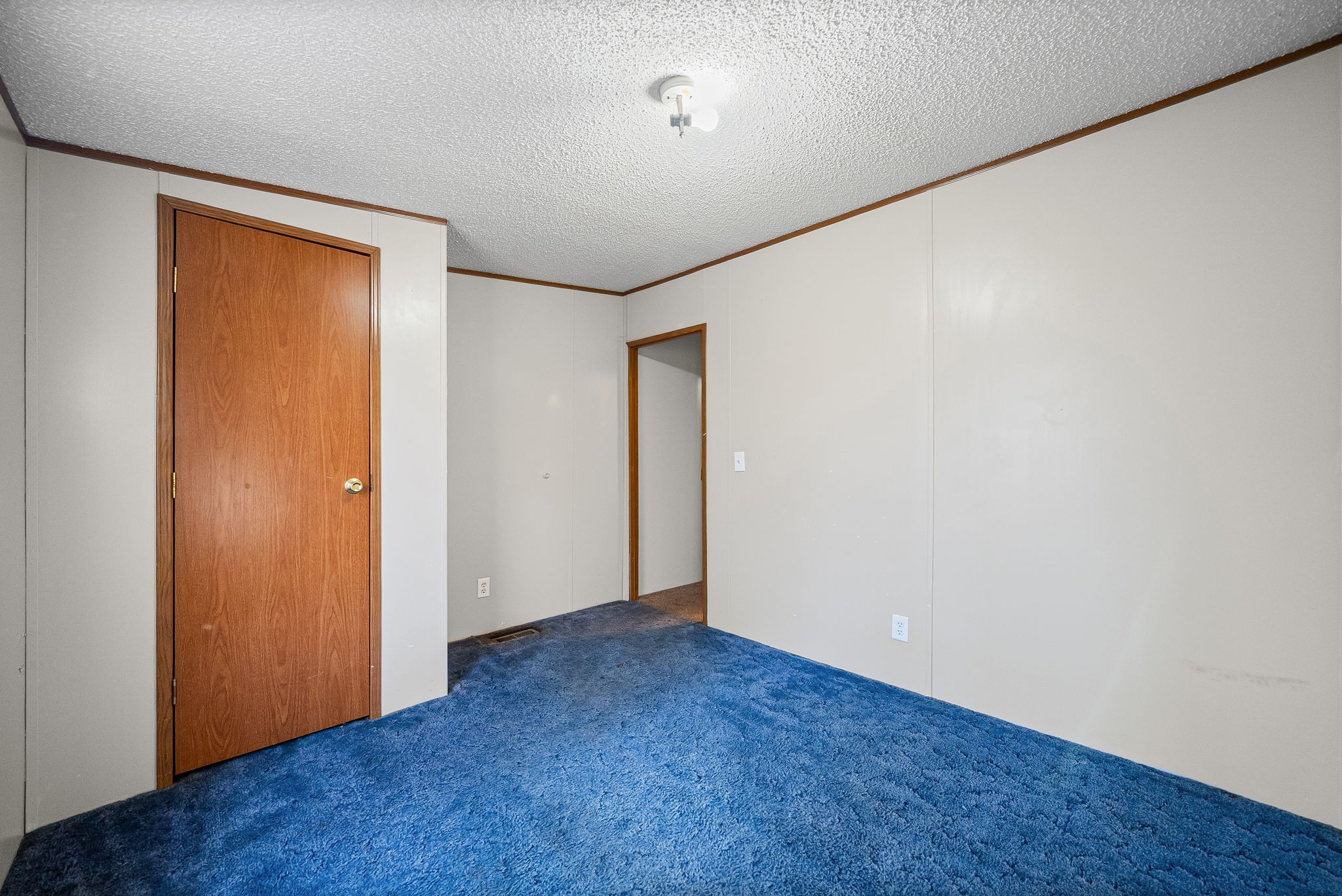 1105 Valley View Road Ashland City, TN 37015 - Photo 21 of 28 an empty room with wooden floor and closet
