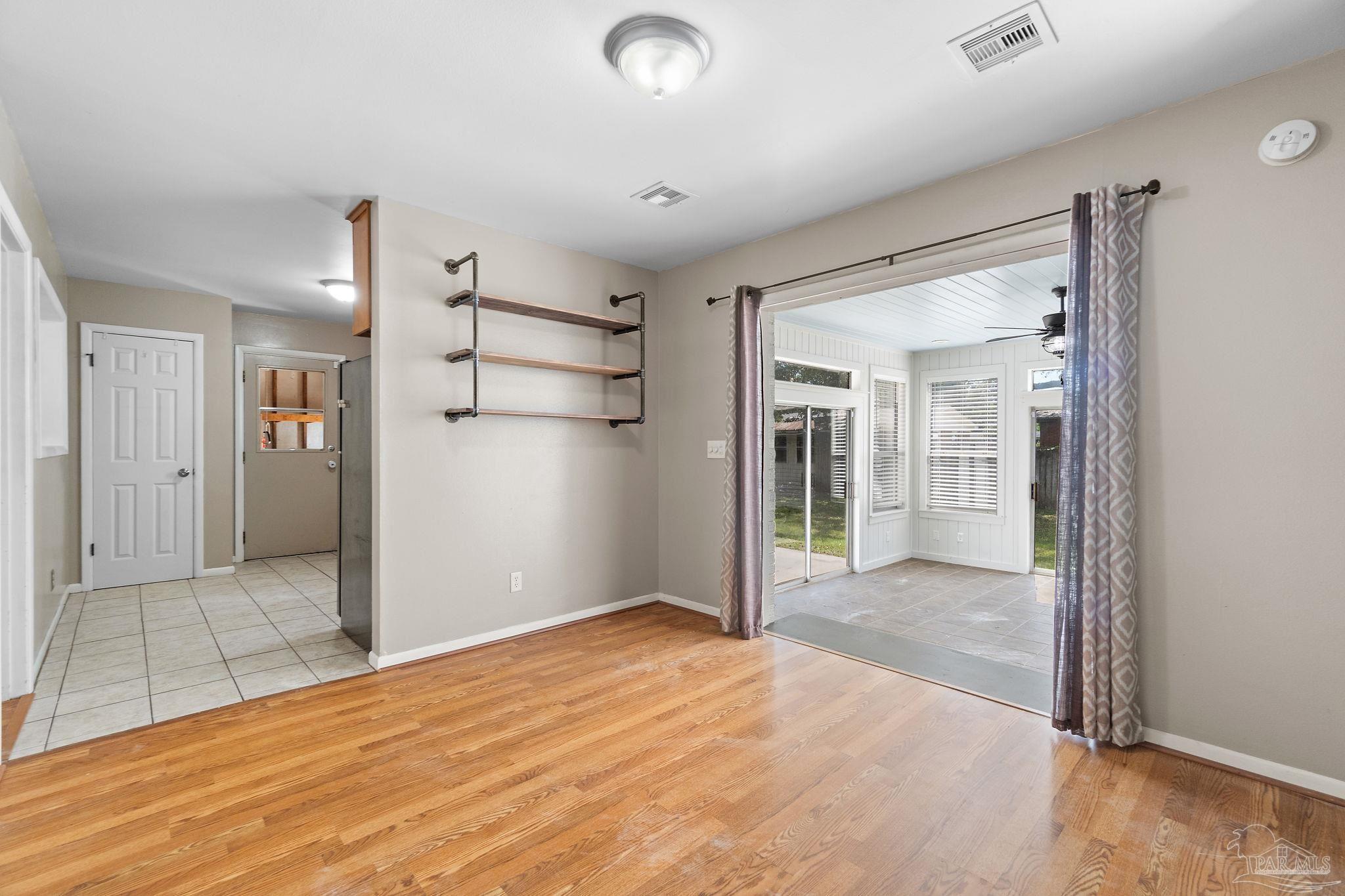 2969 Sky Crest Drive Pensacola, FL 32514 - Photo 15 of 50 a view of empty room with wooden floor and cabinet