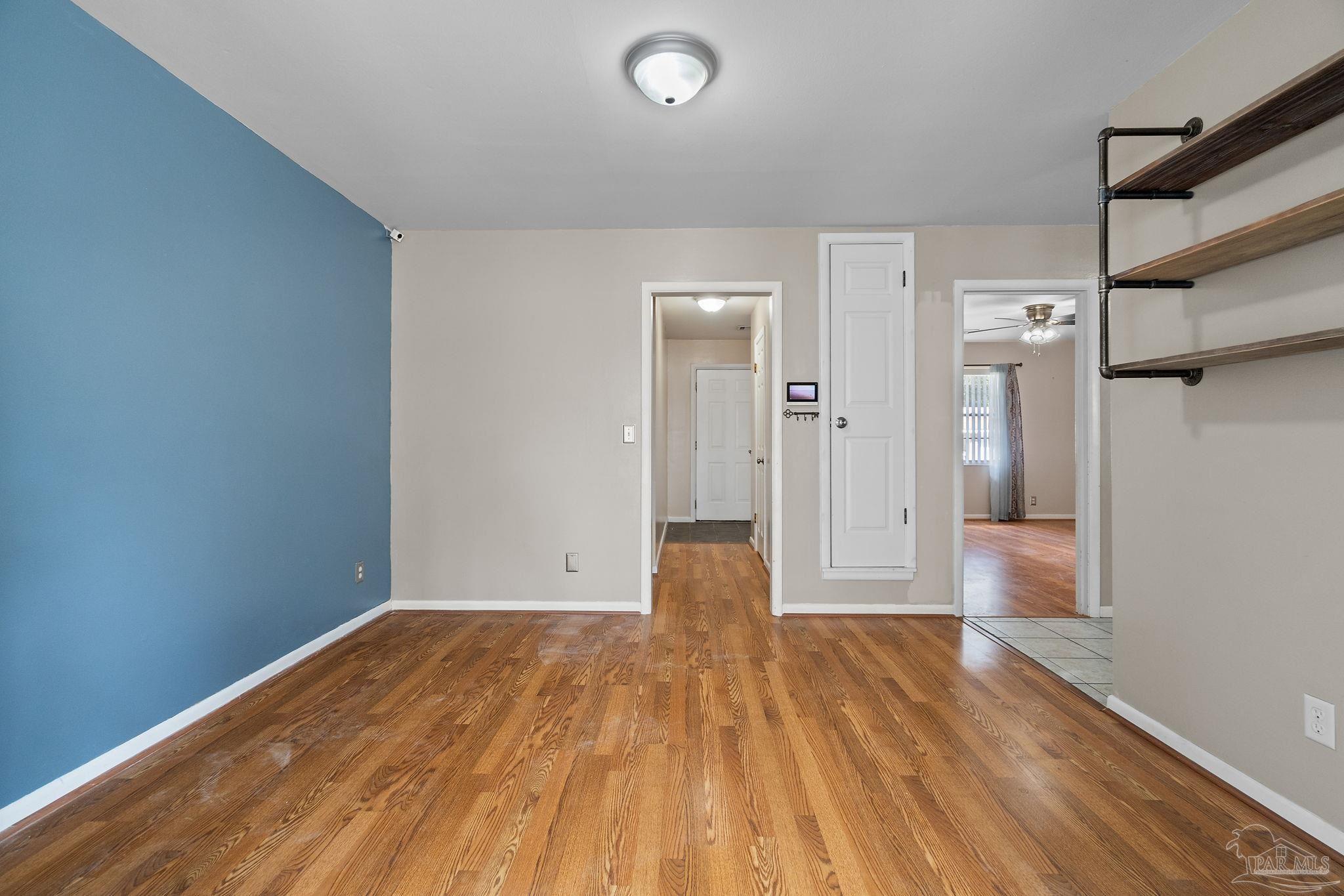2969 Sky Crest Drive Pensacola, FL 32514 - Photo 16 of 50 wooden floor in an empty room with a window