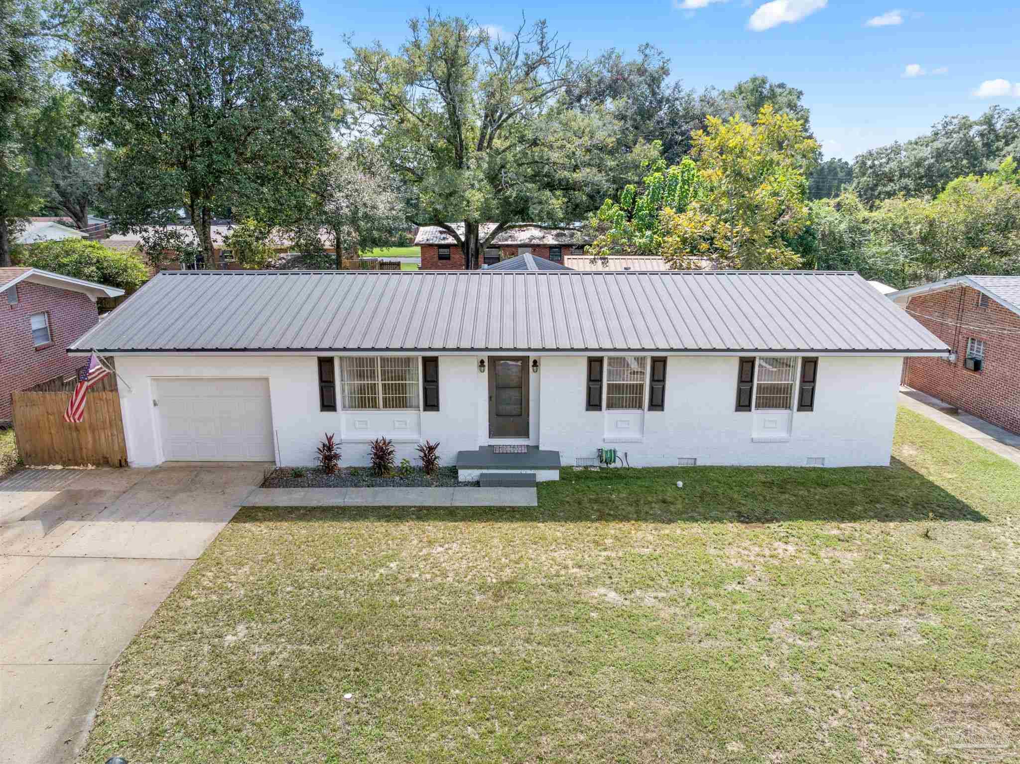 2969 Sky Crest Drive Pensacola, FL 32514 - Photo 41 of 50 a front view of a house with a yard