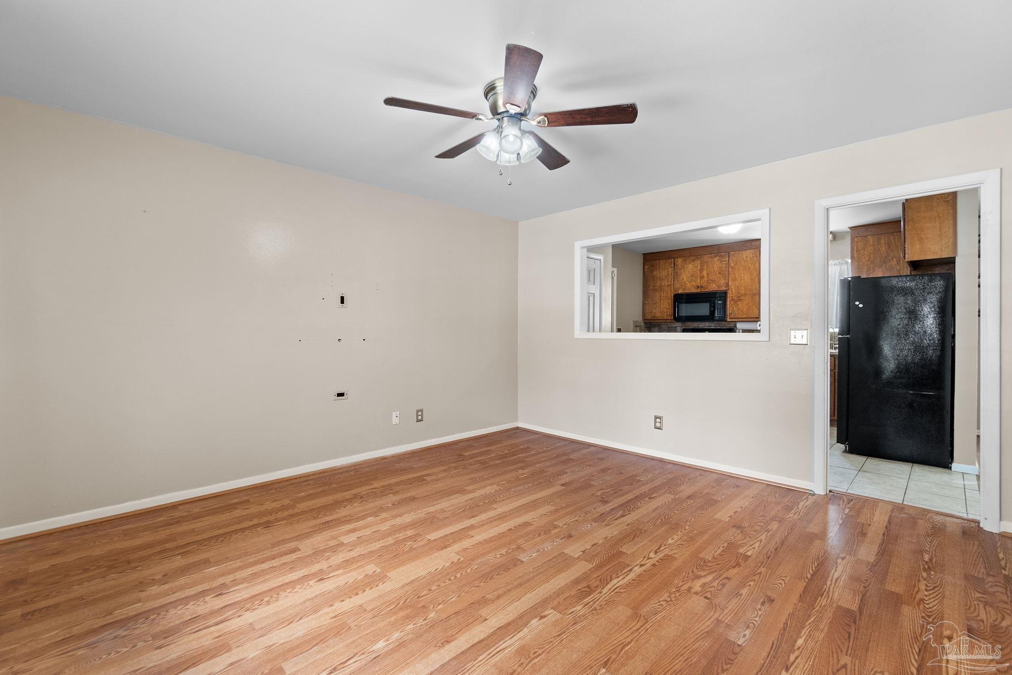 2969 Sky Crest Drive Pensacola, FL 32514 - Photo 6 of 50 a view of an empty room with wooden floor
