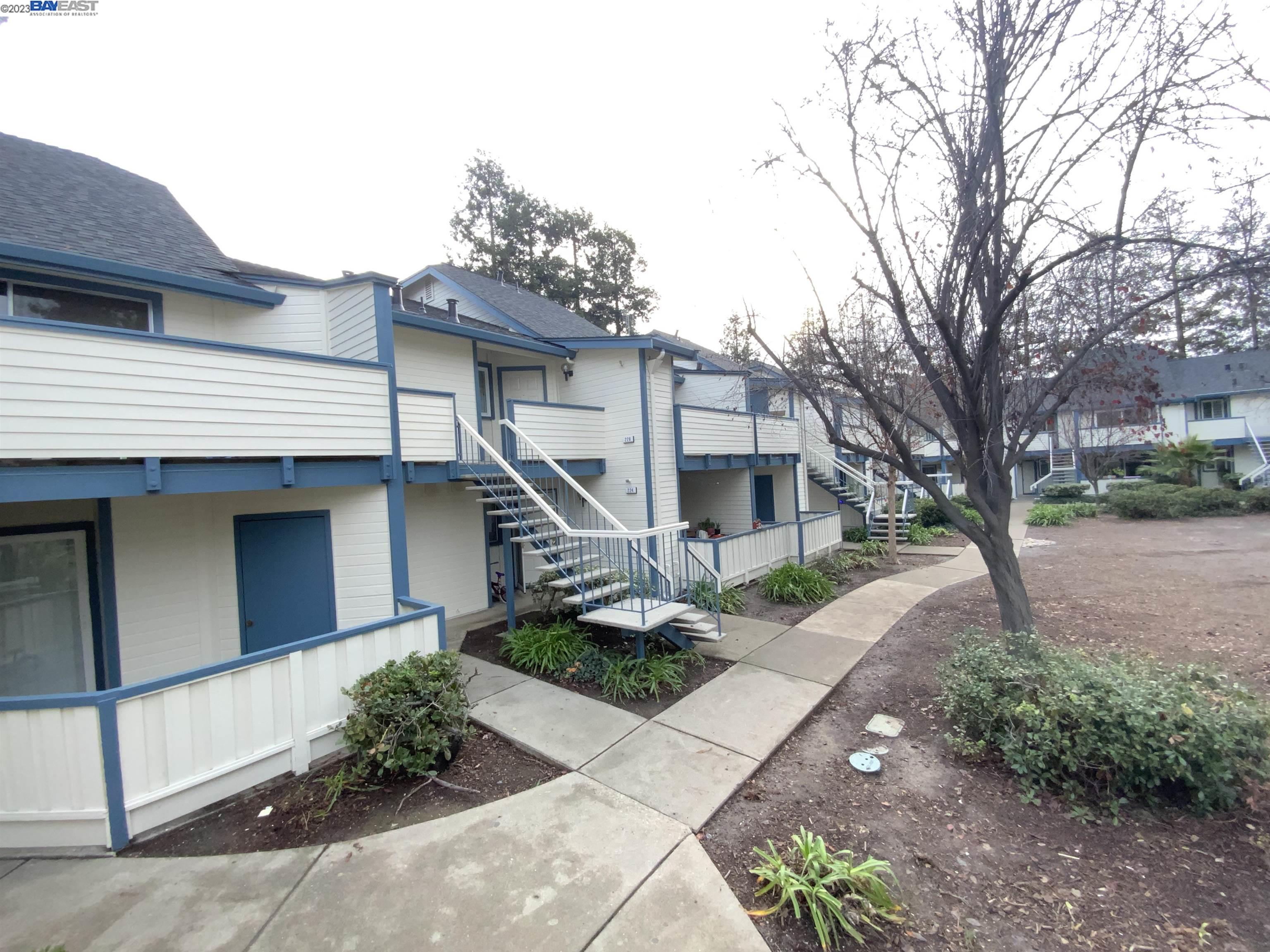 a front view of a house with a yard and a garage