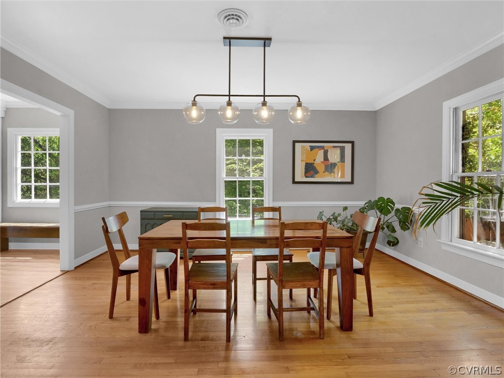 3933 Cresthill Road Chester, VA 23831 - Photo 17 of 49 a view of a a dining room with furniture window and wooden floor