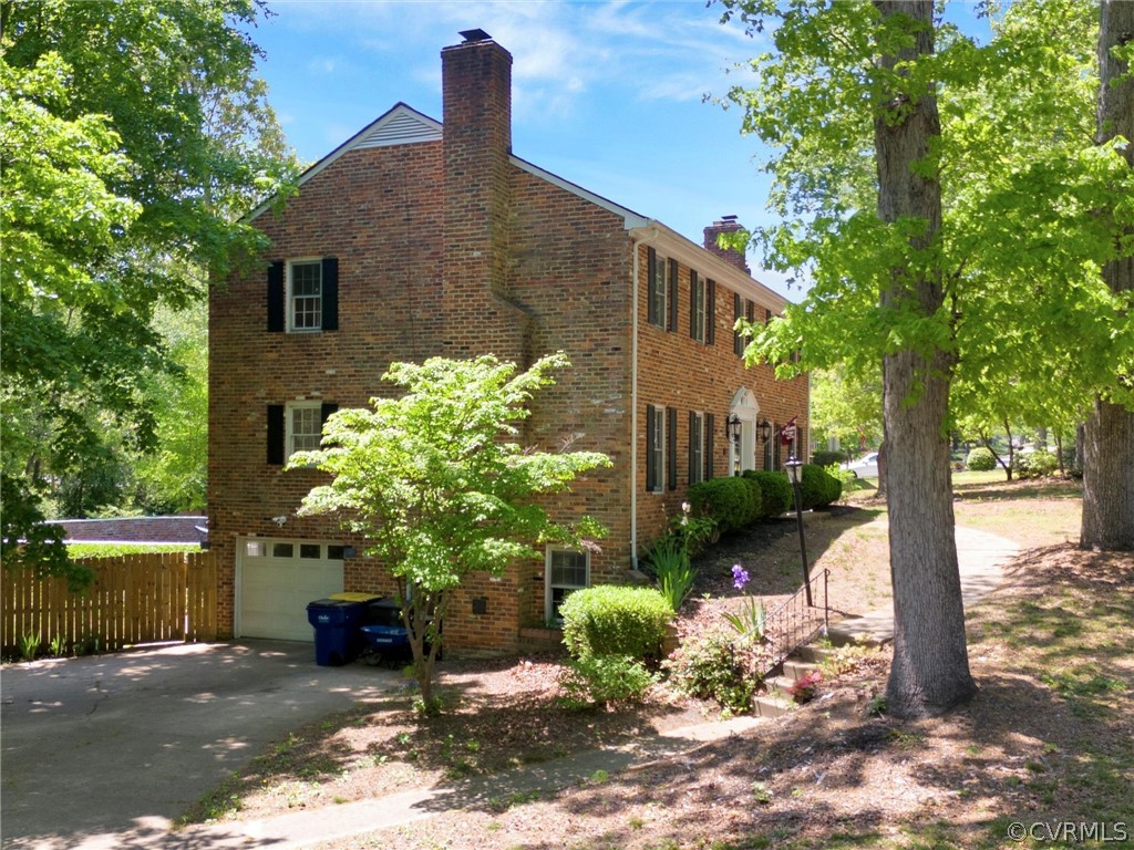 3933 Cresthill Road Chester, VA 23831 - Photo 2 of 49 a front view of a house with garden