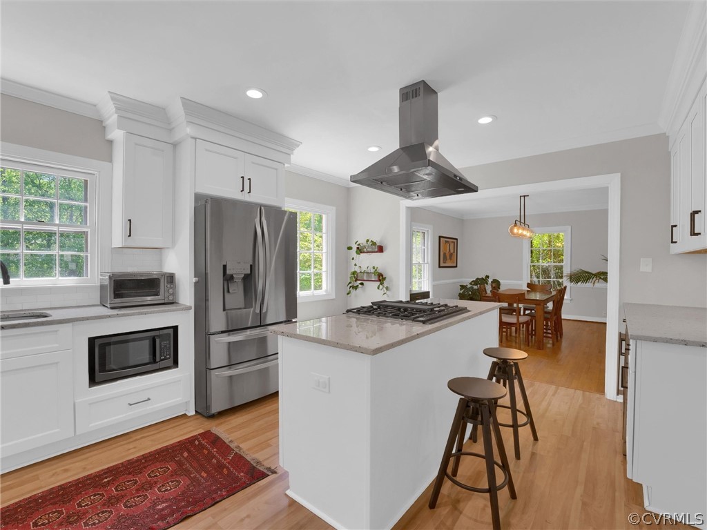 3933 Cresthill Road Chester, VA 23831 - Photo 23 of 49 a kitchen with kitchen island a stove a refrigerator and a stove top oven