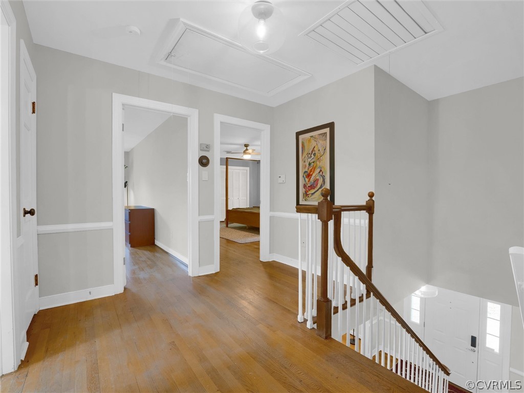 3933 Cresthill Road Chester, VA 23831 - Photo 31 of 49 a view of a hallway with wooden floor and stairs