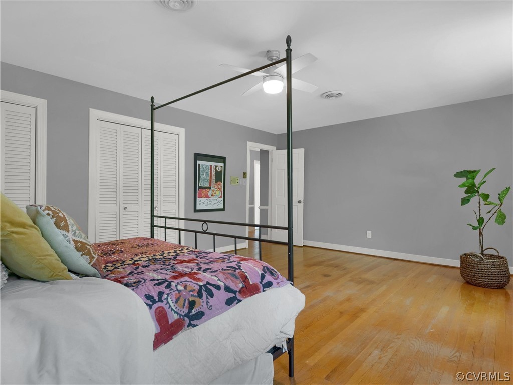 3933 Cresthill Road Chester, VA 23831 - Photo 35 of 49 a bedroom with a bed and a potted plant