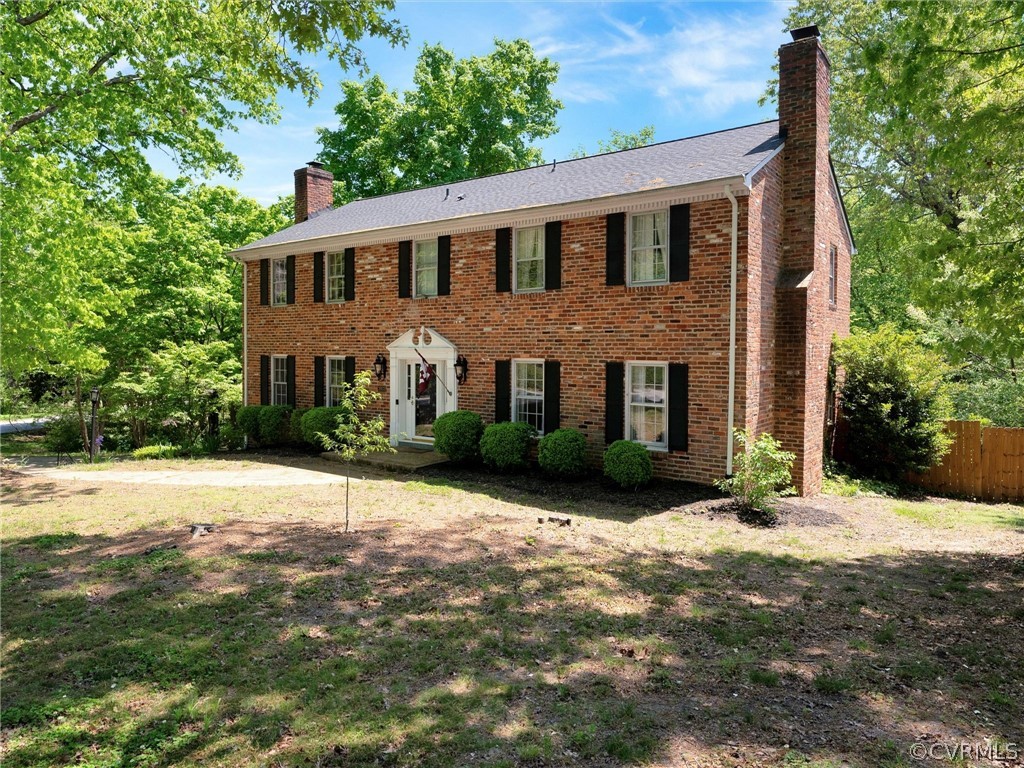 3933 Cresthill Road Chester, VA 23831 - Photo 7 of 49 a view of a brick house with a yard