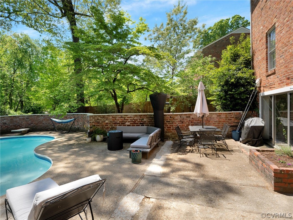 3933 Cresthill Road Chester, VA 23831 - Photo 8 of 49 a view of backyard with a table and chairs