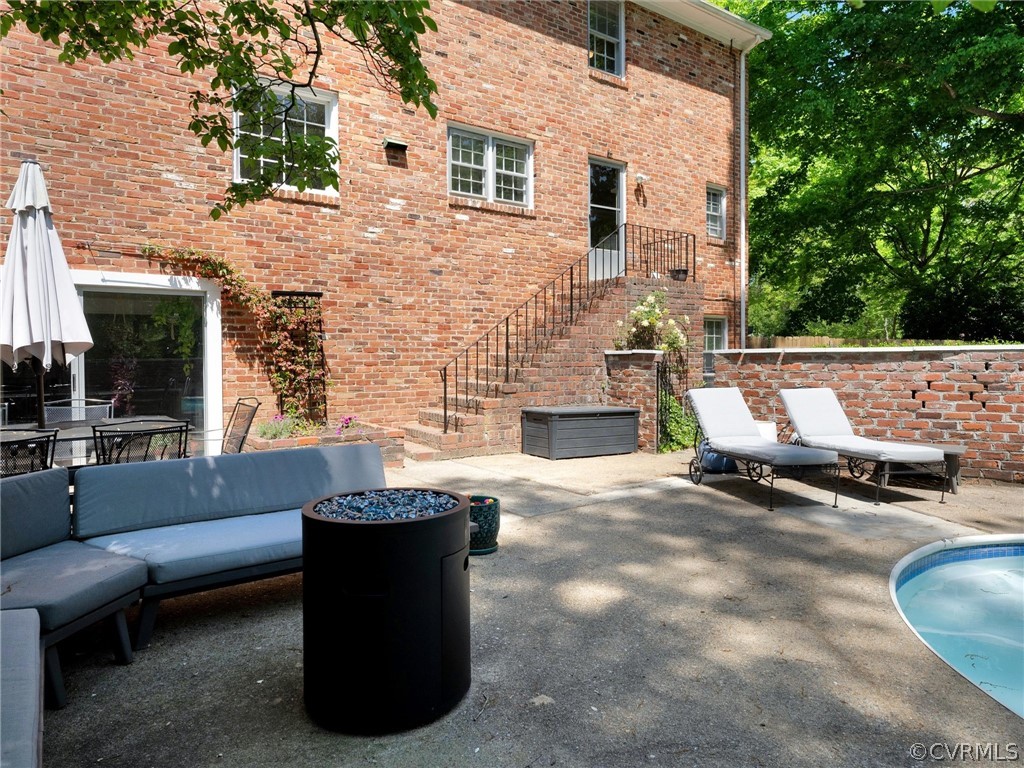 3933 Cresthill Road Chester, VA 23831 - Photo 10 of 49 a view of a patio with couches and a fire pit