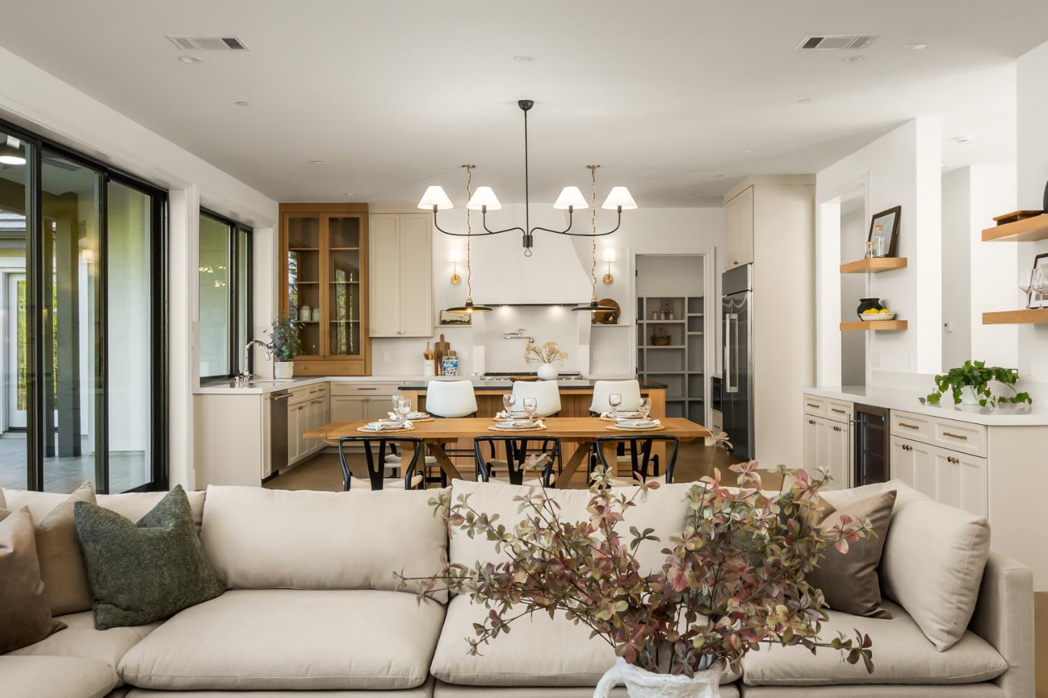 1632 The Point Meadow Vista, CA 95722 - Photo 15 of 60 a living room with furniture chandelier and a large window