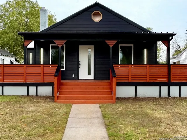 a view of bench sitting in front of building