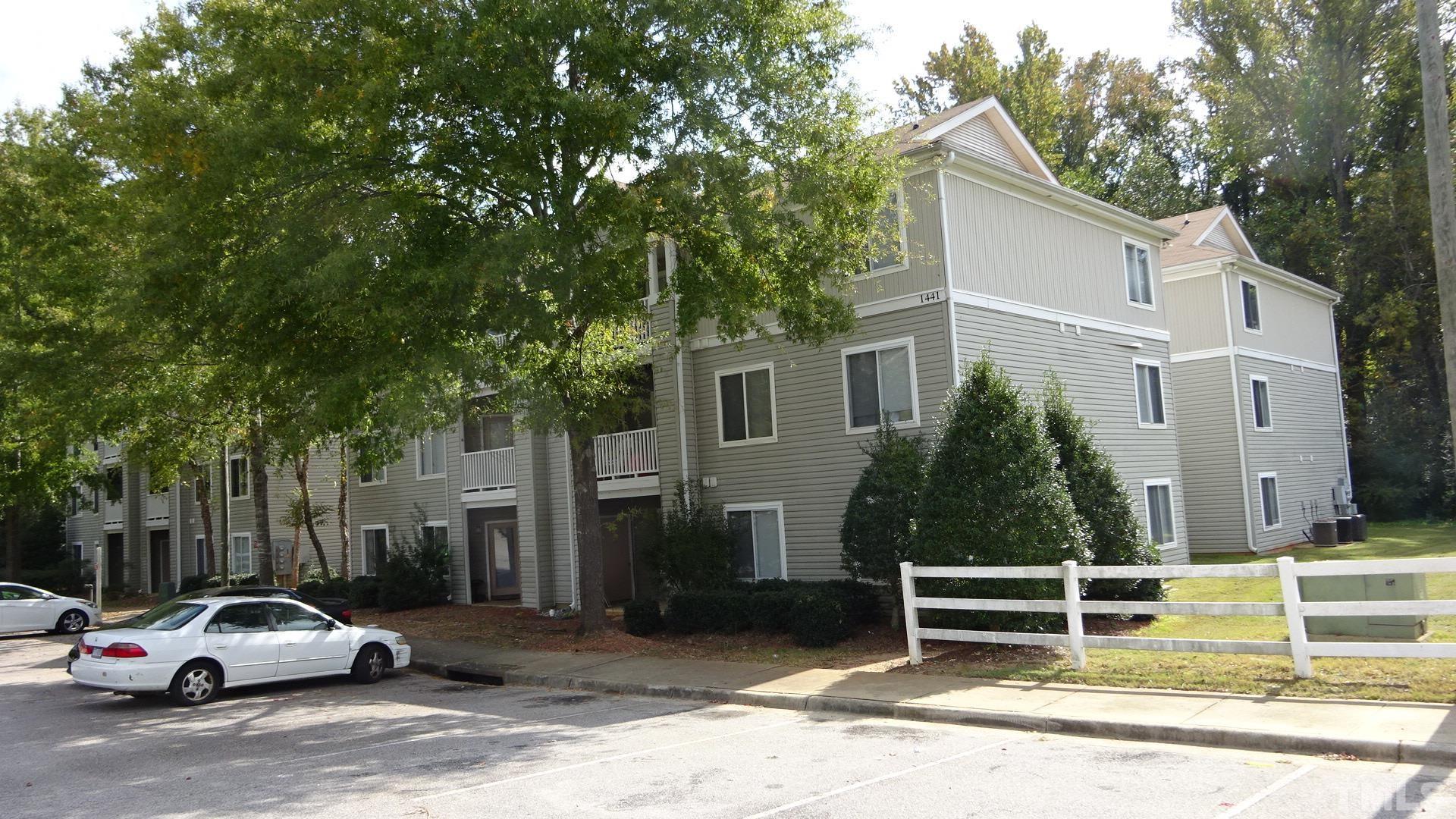 1441 Collegiate Circle, Unit 304 Raleigh, NC 27606 - Photo 1 of 24 a view of a car park in front of house