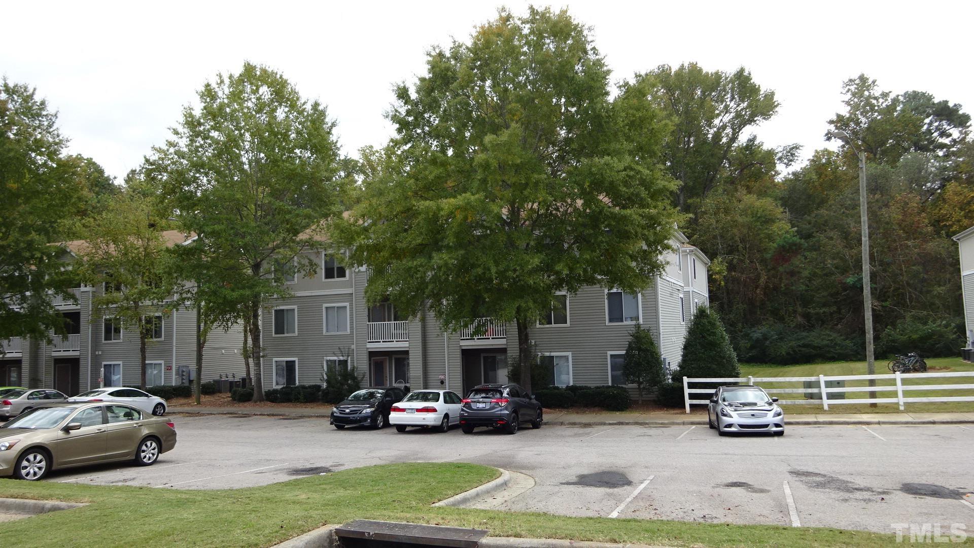 1441 Collegiate Circle, Unit 304 Raleigh, NC 27606 - Photo 24 of 24 a view of car parked in front of house