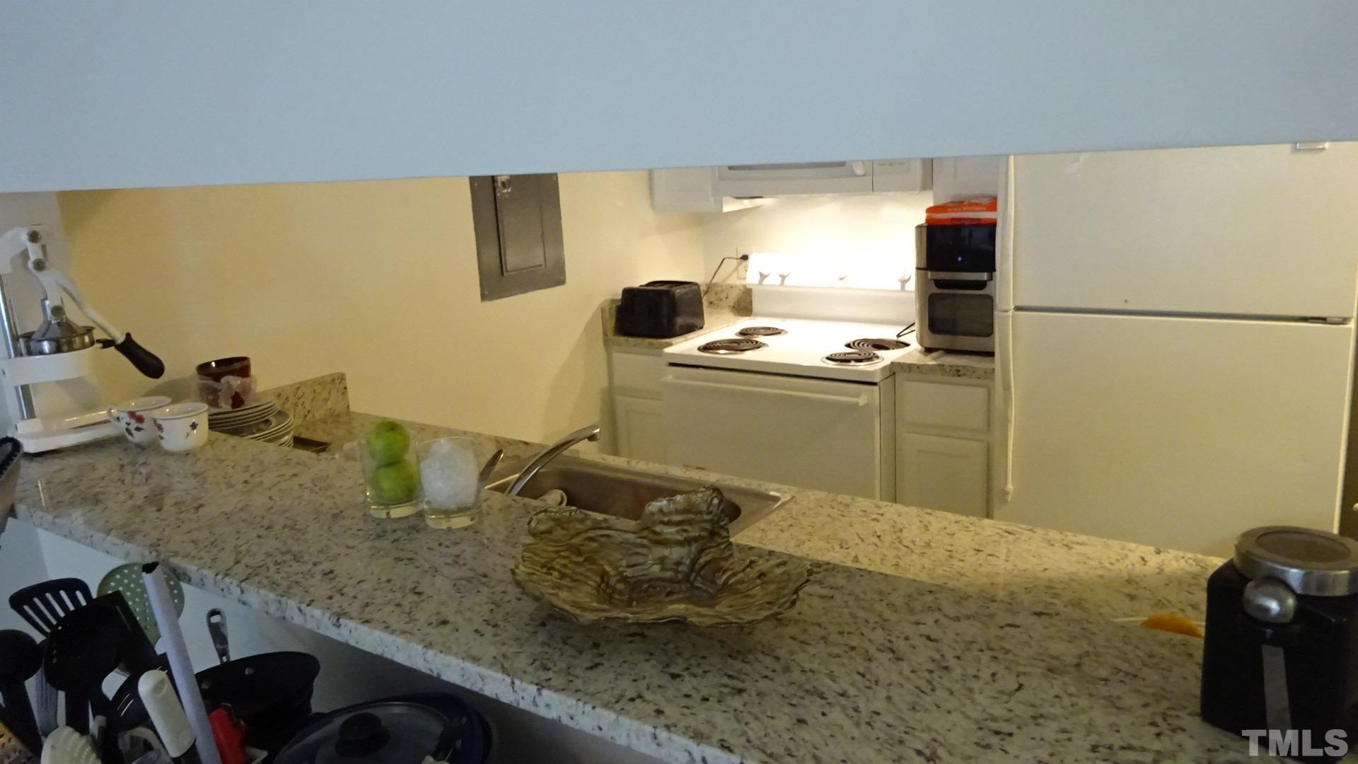 1441 Collegiate Circle, Unit 304 Raleigh, NC 27606 - Photo 8 of 24 a room with counter top space and appliances